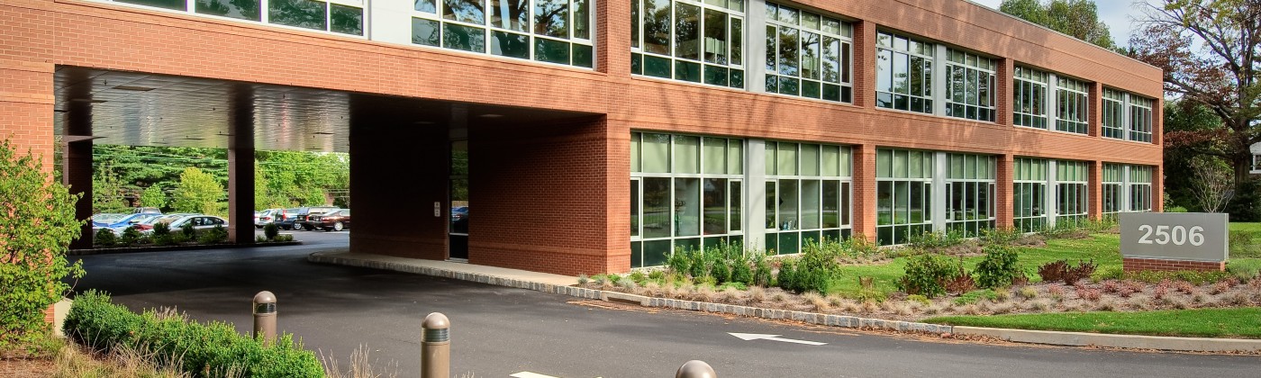 Exterior shot of a two-story, brick office building