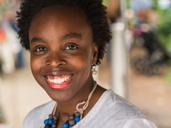 woman smiling in white top