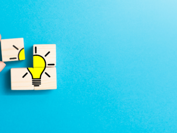 Migrated automatically. a person placing a missing puzzle piece of what is a lightbulb image