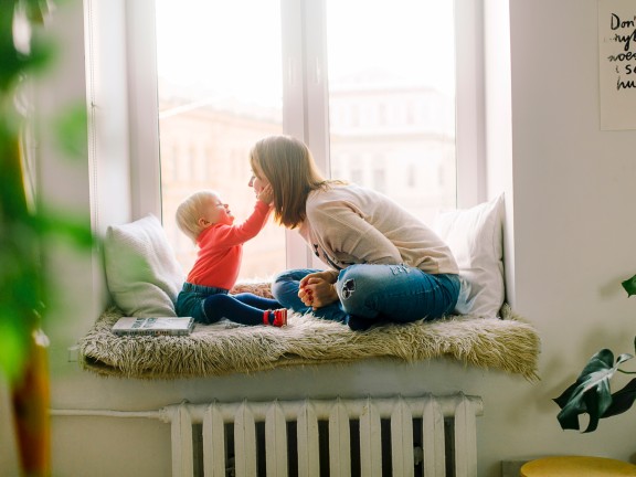 mom and baby sitting inside