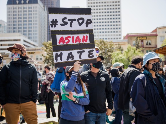 Migrated automatically. woman standing with sign