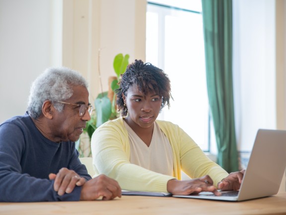 Migrated automatically. young woman and older adult using a computer