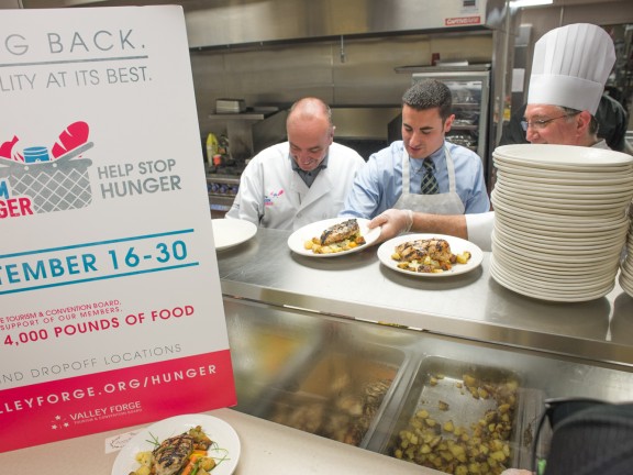 Migrated automatically. Three chefs working in a kitchen.