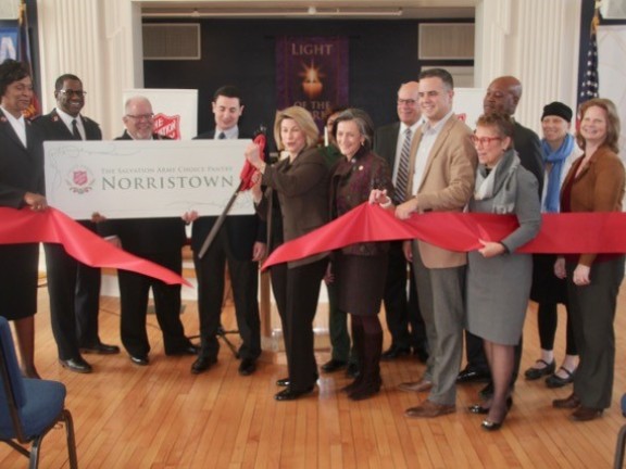 Migrated automatically. Line of people at a ribbon cutting ceremony.