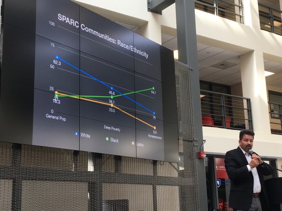 Migrated automatically. Jeff Olivet, senior advisor to the Center for Social Innovation shows data on the impact of homelessness on African American, Latino and white communities. Photo by Tamela Luce.