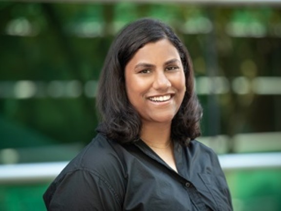 A picture of a smiling woman wearing a black shirt.
