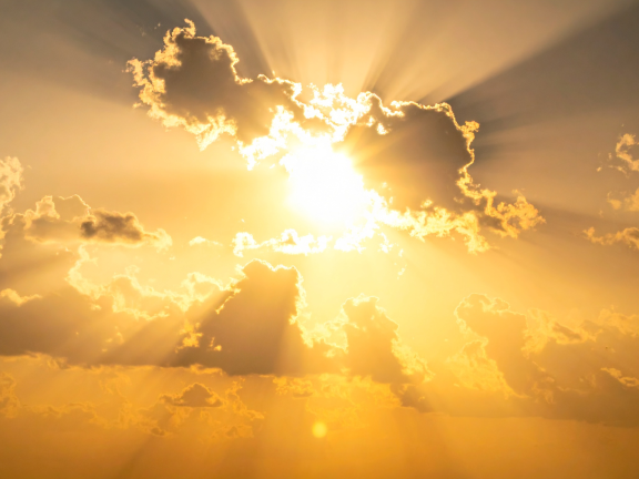Sun shining through clouds