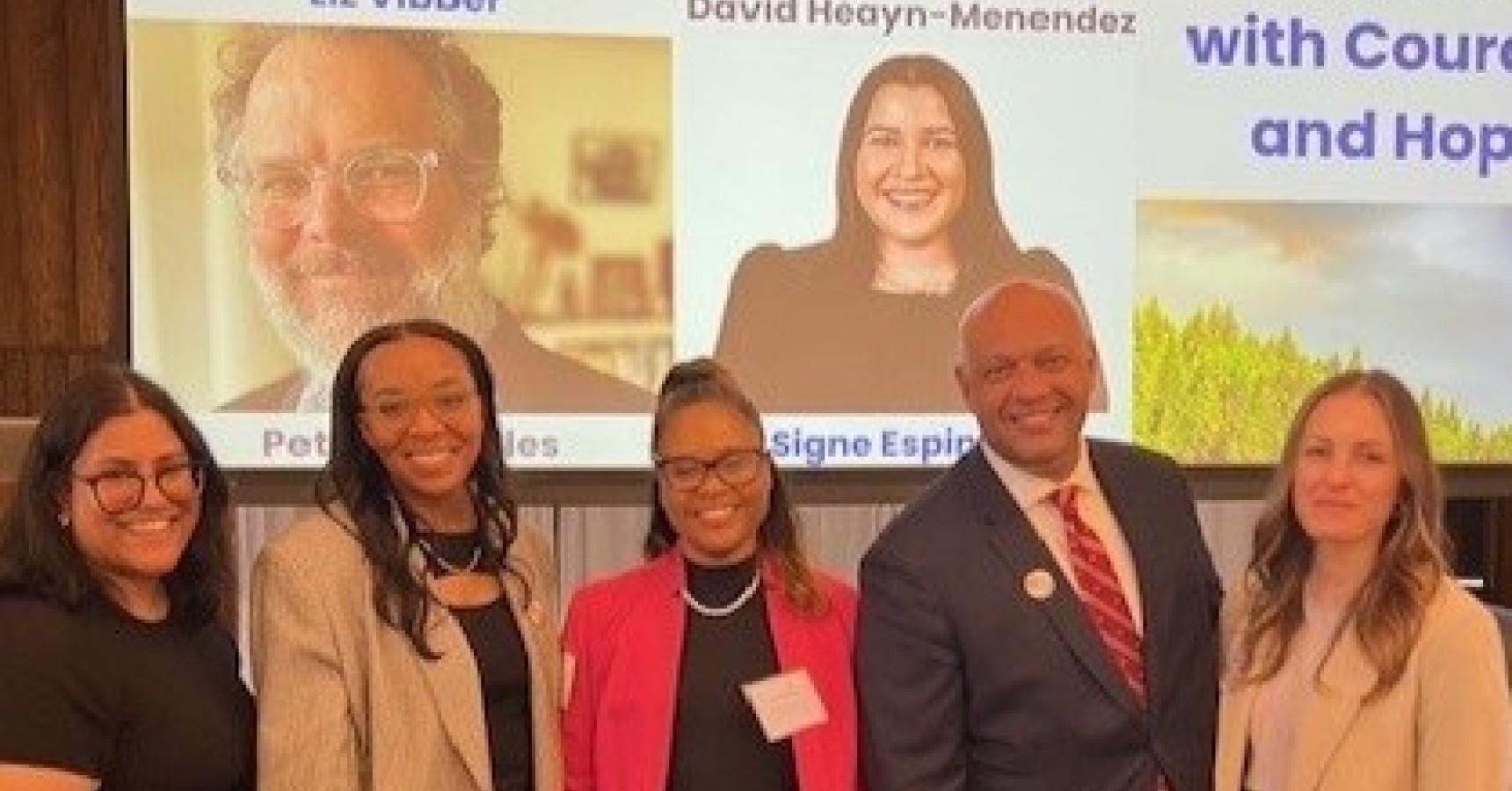 A group of people smiling.