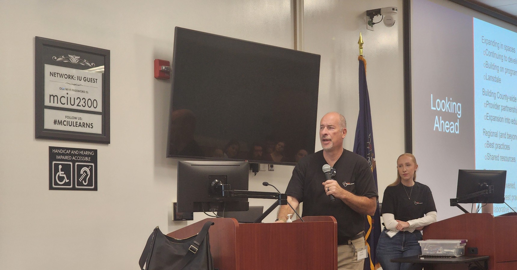 man speaking into a microphone