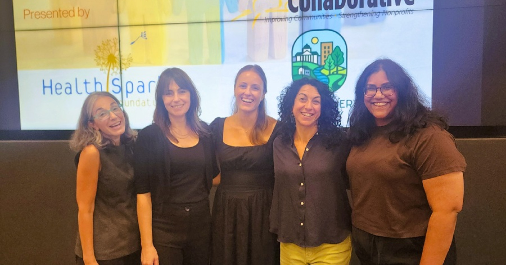 A group of women smiling.