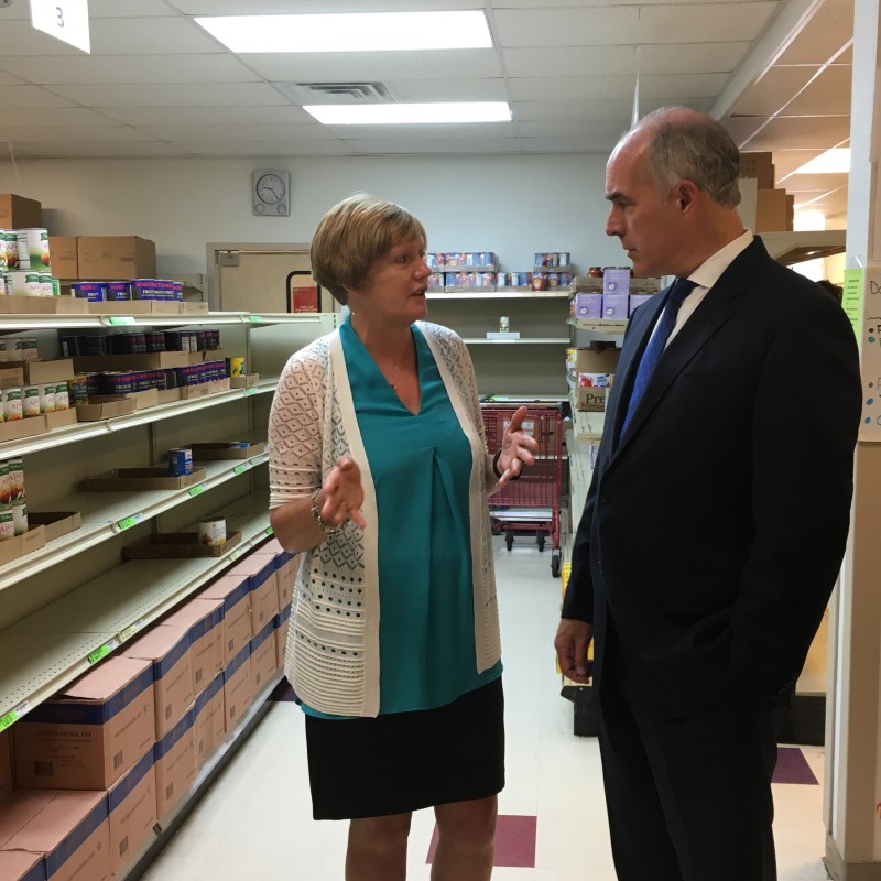 Pottstown Cluster of Religious Communities Executive Director Barbara Wilhelmy gives Sen. Bob Casey a tour of their food pantry. All photos by Tamela Luce.