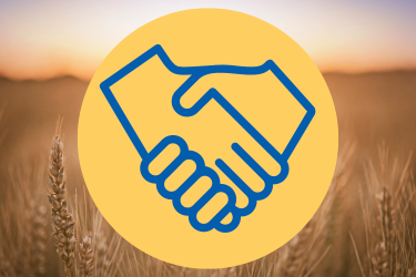 A graphic design icon of two hands shaking, over a background image of a field of wheat.