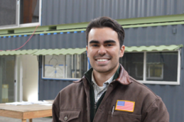 image of smiling man with brown hair
