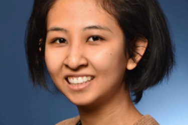 image of smiling woman with short brown black hair