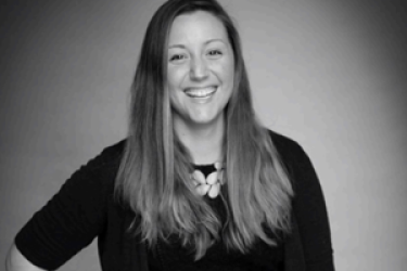 black and white photo of smiling woman with long hair
