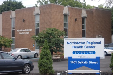 Two story brick building with a sign that reads, "Norristown Regional Health Center."