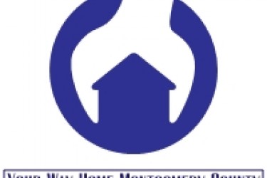 Logo of a house enveloped by a wrench, with the words, "Your Way Home Montgomery County" underneath.